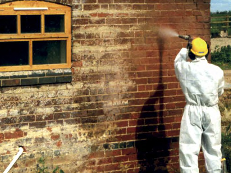 Building restoration paint removal from brickwork